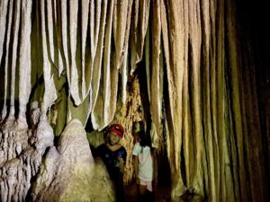 kids in a cave with stalactites Belize cave inland tours adventure 